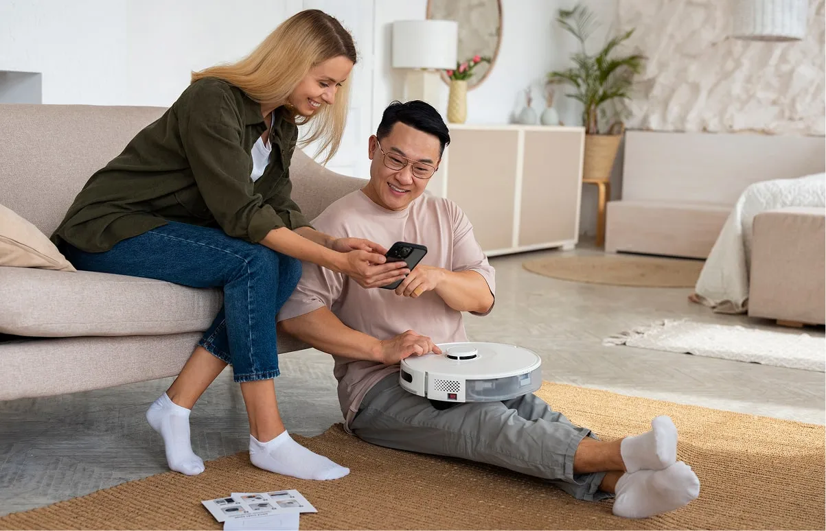 Technician setting up a smart security device with a customer