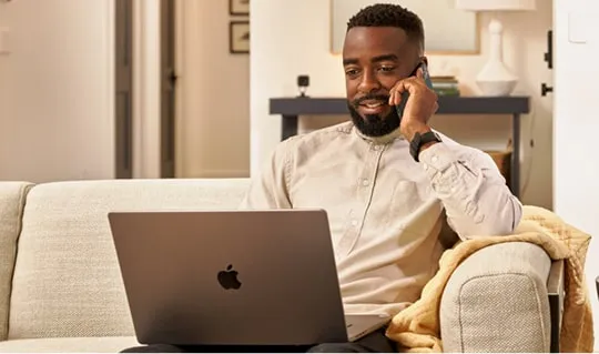Professional working on a laptop in an office